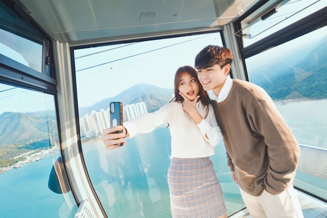 Couple enjoying the Ngong Ping 360 cable car ride