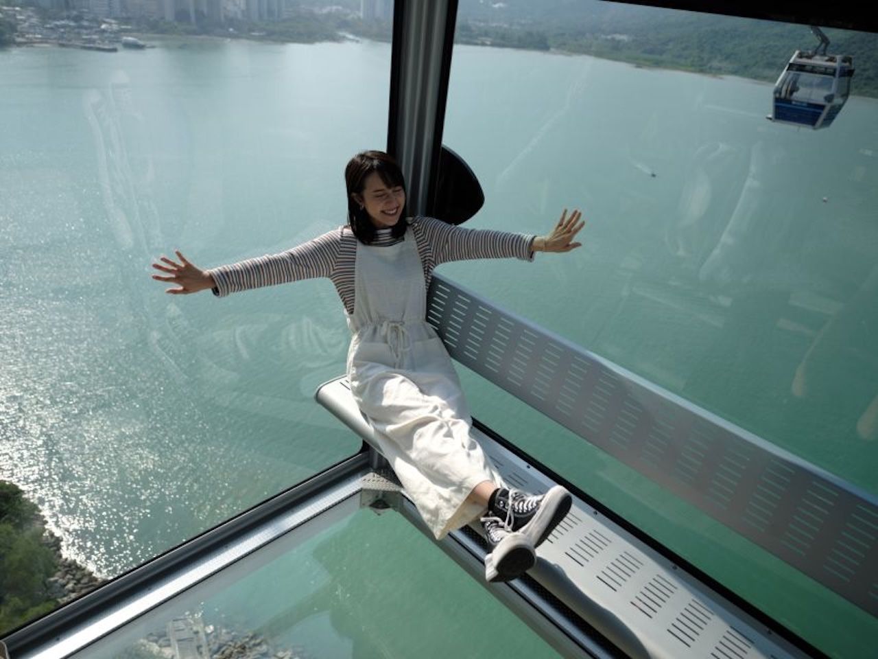 Ngong Ping 360 Crystal Cabin glass floor over the hills