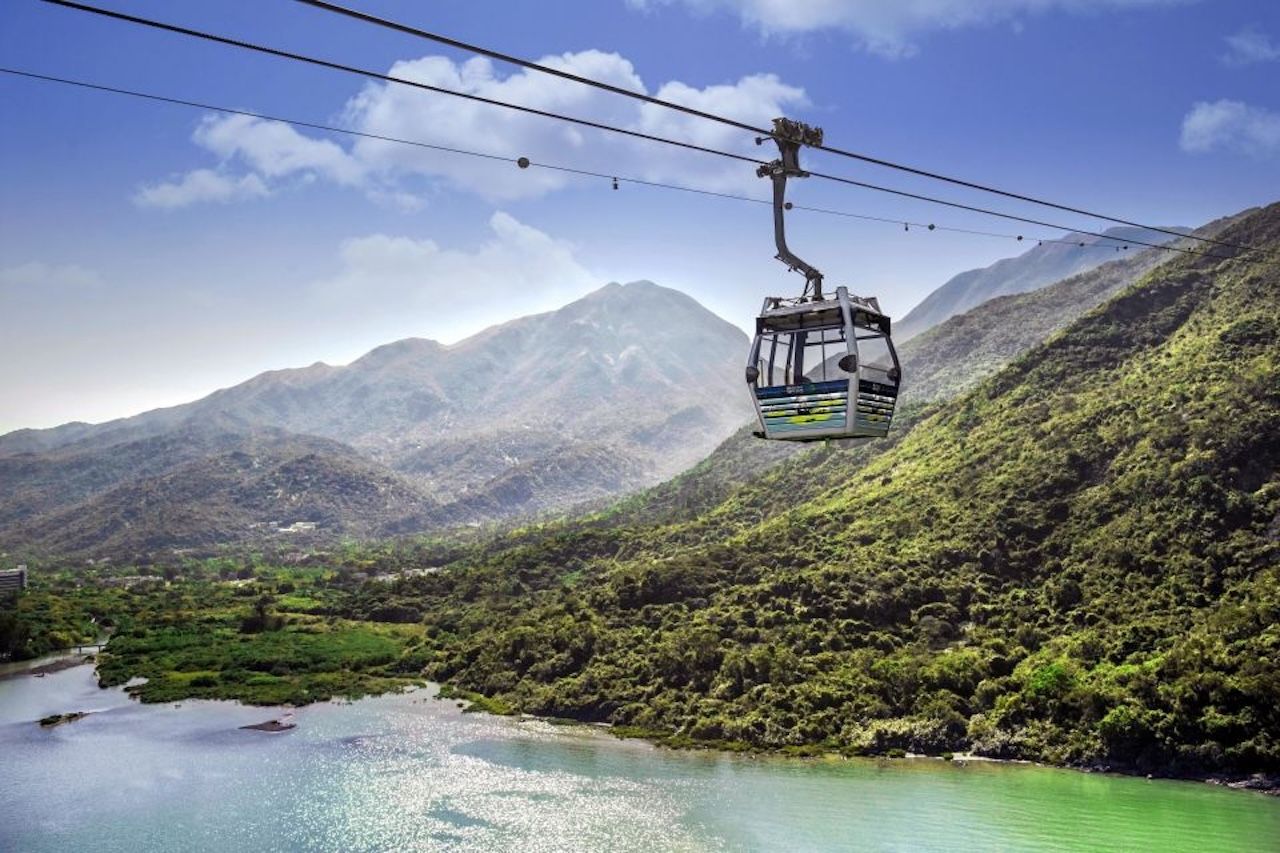 Ngong Ping 360 cable car crossing Lantau's mountains and Tung Chung Bay